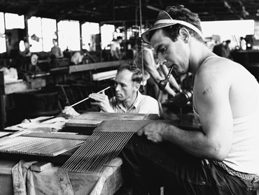Virgina Robinson making a final inspection of tiny bulb and capillary tubes as components for modern temperature controls - Thumbnail